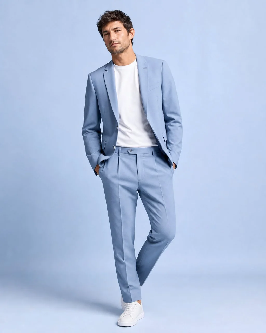A luxury studio fashion editorial of a subject in stylish outfit with bold accent accessories against a seamless colored backdrop and clean softbox lighting.