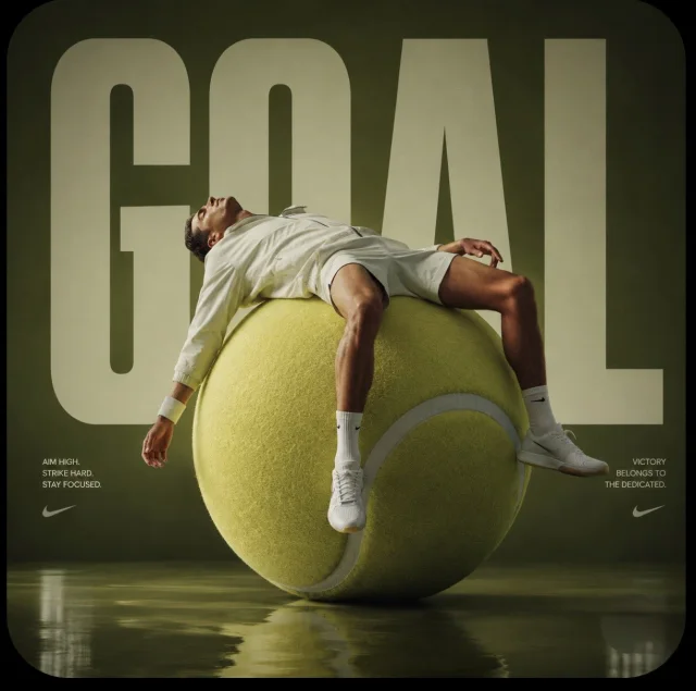 An avant-garde sports fashion advertisement showing a male athlete sprawled across a monumental oversized tennis ball in a burnt green studio, with huge GOAL typography behind and a shiny mirrored floor.